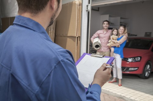 Careful loading of a wardrobe and bed frame for collection