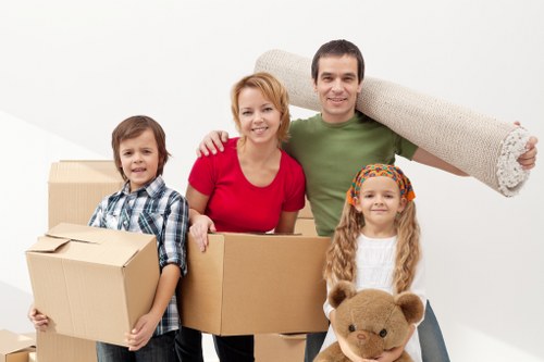 Packed moving boxes and furniture for a local house removal