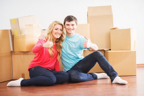 Professional removal team planning a move with boxes and furniture