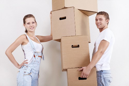 Removals team planning a move with boxes and furniture